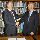 Bo Mathiasen and Emmanuel Reinert sign the MoU. (Photo: UNODC)