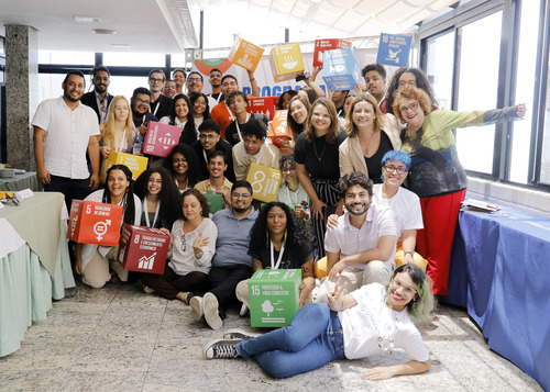 UNODC Youth Ambassadors Programme participants holding the Sustainable Development Goals (SDGs)