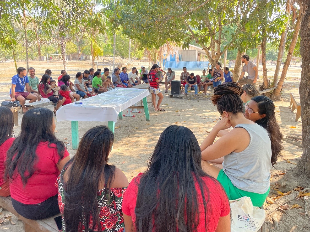 Members of the Tapajós community sitting in a circle at a meeting organized by UNODC