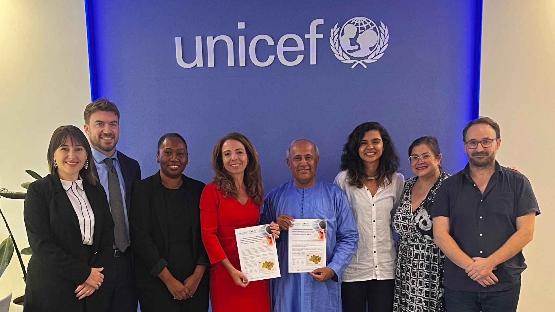 Representatives of UNICEF and UNODC celebrate partnership.