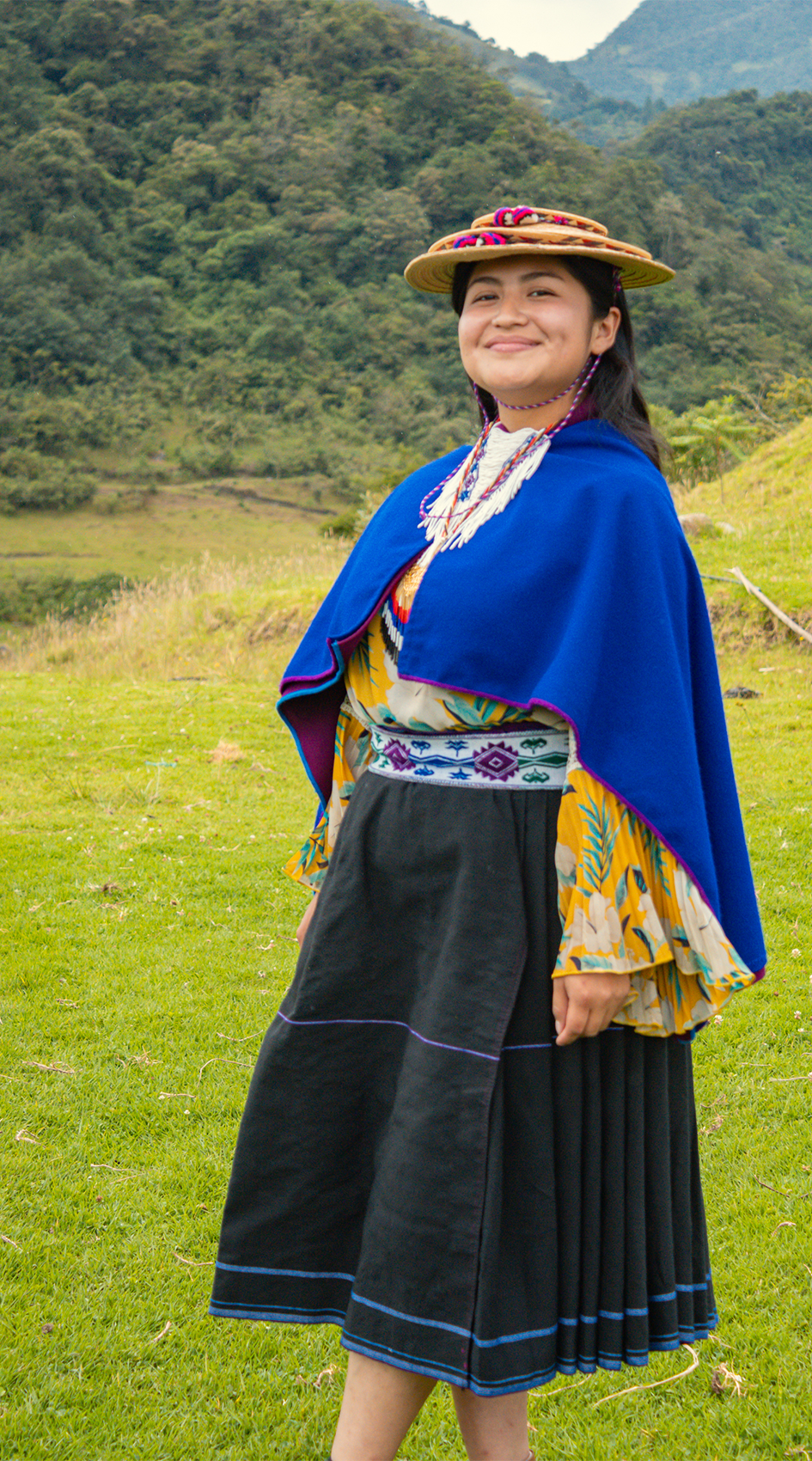 Rossy and the landscape of the Guambia reserve behind her.